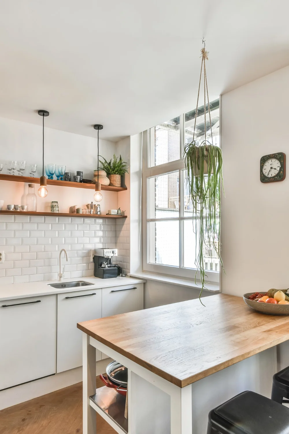 A cozy kitchen featuring a sink and counter, showcasing a warm and inviting cooking space