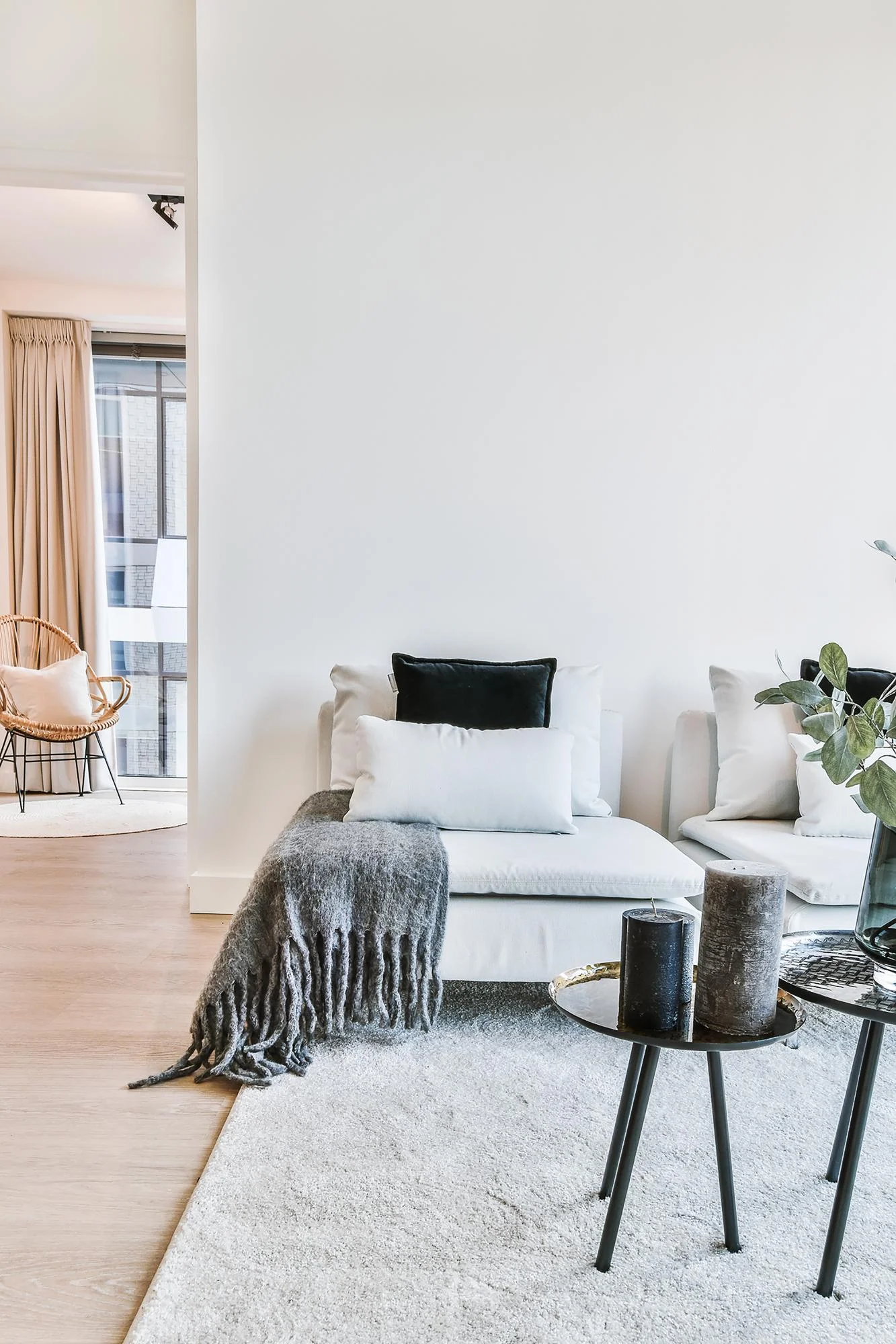 A contemporary living room featuring white walls, wooden floors, and stylish furnishings for a bright, inviting atmosphere